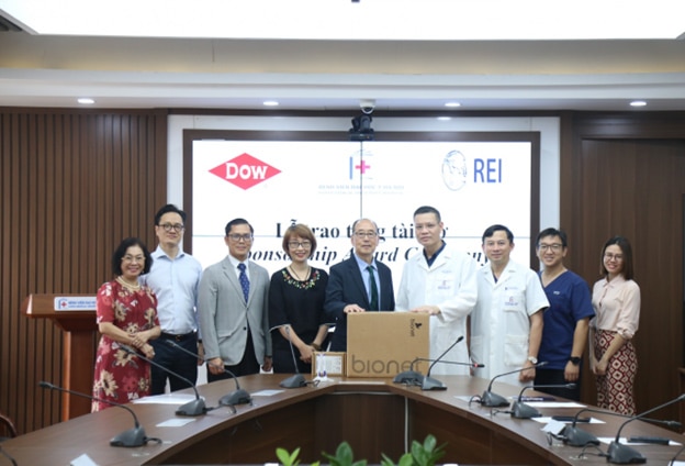 A group of people standing in fron of a podium